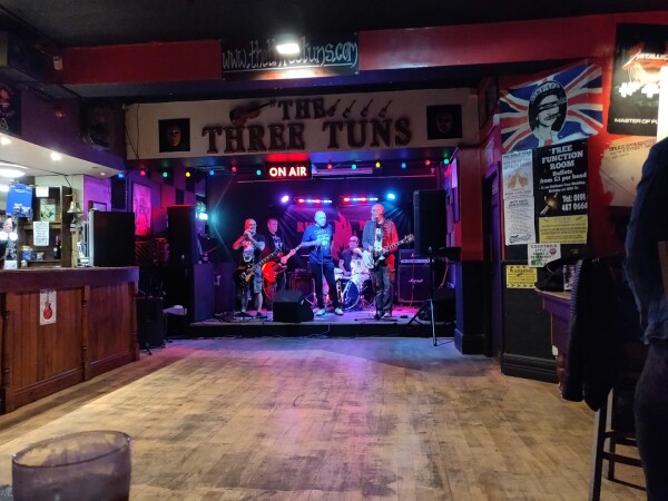 Live music stage inside The Three Tuns in Gateshead