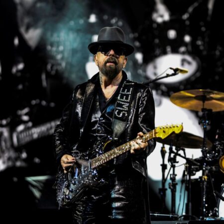 Dave Stewart performing live with guitar